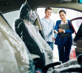 Manager showing car interior